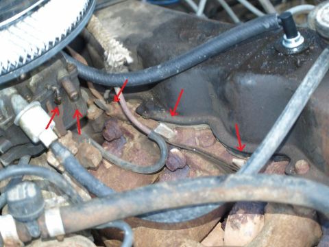 1986 Ford Bronco - What the hell is all this mess? Crimped? Someone remove EFI or somthing? And what's with all the bare nipples? Looks like a strip club in t…