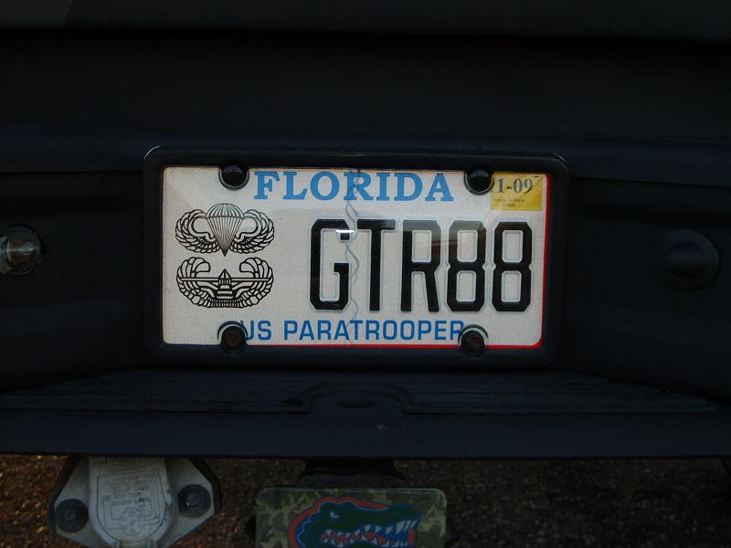 Florida US Paratrooper license plate GTR88 with jump wings on a dark vehicle bumper