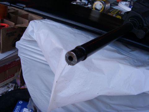 1978 Ford Bronco - A close-up view of a component, possibly from a vehicle, covered by protective sheeting.