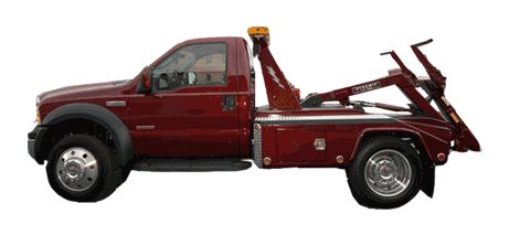 1990 Ford Bronco - This is a side view of a red tow truck with its equipment extended.