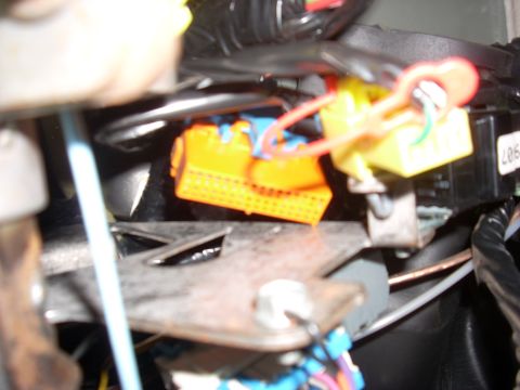 2000 Chevrolet Tahoe - Close-up view of electrical connectors and wiring within a vehicle's interior.