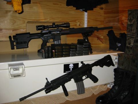 1996 Ford Bronco - A collection of firearms and ammunition is displayed on a shelf.