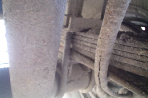 1979 Ford Bronco - Underside view of vehicle suspension components, including leaf springs.