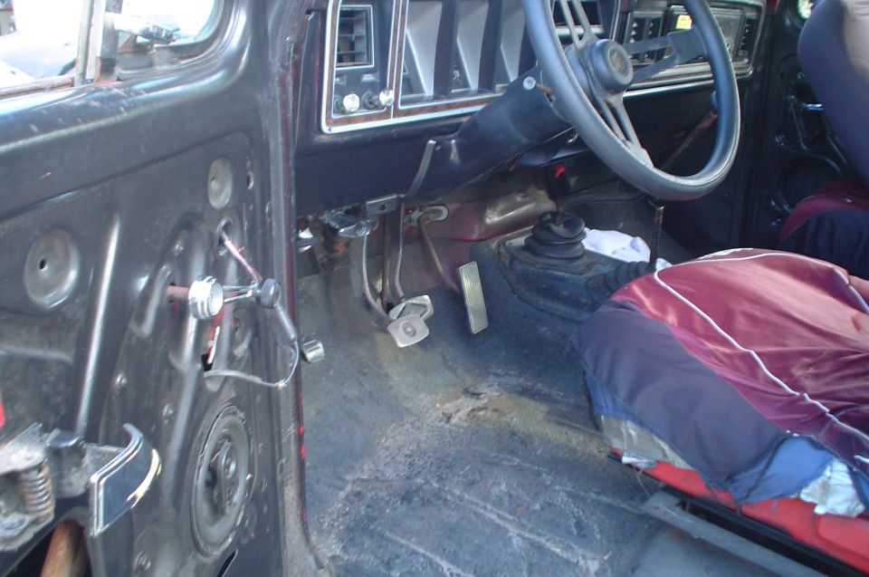 Interior view of a 1979 Ford Bronco showing dashboard, steering wheel, and seats