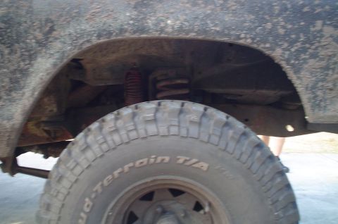 1979 Ford Bronco - BFGoodrich Mud-Terrain T/A tire and suspension components are visible in this close-up shot.
