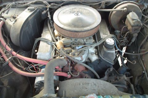 1979 Ford Bronco - Close-up view of a vehicle's engine compartment, showing various mechanical components and wiring.