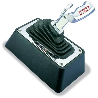 1972 Plymouth Valiant - This B&M floor shifter features a chrome handle and a visible gear indicator, commonly used in performance vehicles.