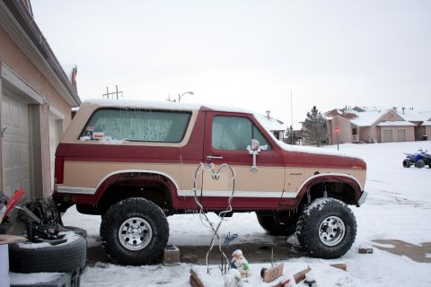 1986 Ford Bronco - tires mounted up on 15x10 wheels. I think it raised the truck another 2 or 3 inches over the 31's