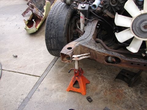 1973 Ford Ranchero - Vehicle frame and engine components are shown supported by jack stands.