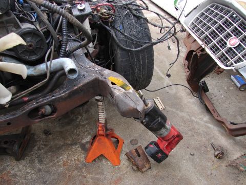 1973 Ford Ranchero - The front end of a 1973 Ford Ranchero is disassembled, showing the frame, engine, and grille.