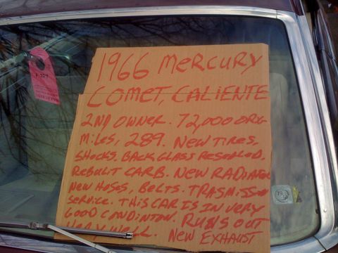 1983 Ford Bronco - A sign on the windshield details the condition and history of a 1966 Mercury Comet Caliente.