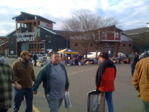 1983 Ford Bronco - People at an outdoor market in front of the Americraft Showplex building.