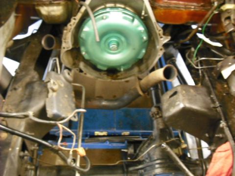 1979 Ford Bronco - The photo shows the underside of a vehicle, focusing on the transmission and exhaust components.