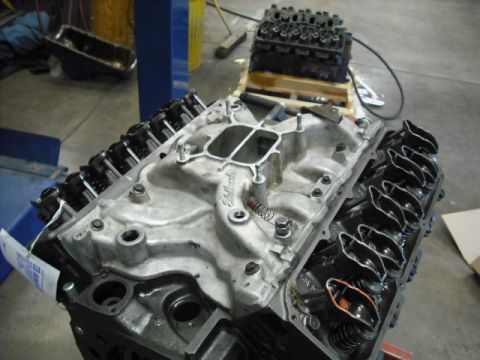 1979 Ford Bronco - Close-up view of an engine's intake manifold, showing the Edelbrock branding and internal components.