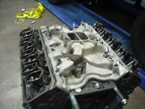 1979 Ford Bronco - Close-up view of an engine's intake manifold and cylinder heads, showing internal parts.