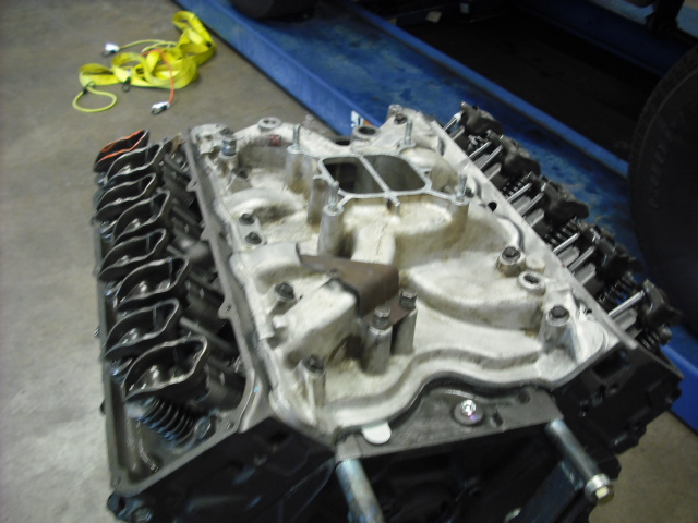 Engine intake manifold and cylinder heads with visible valve train components