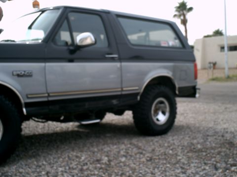 1994 Ford Bronco - Side view of a 1994 Ford Bronco with two-tone paint.