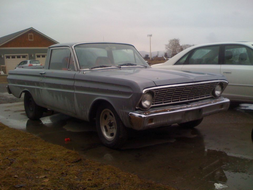 Gray Ford Falcon Ranchero parked outside a house