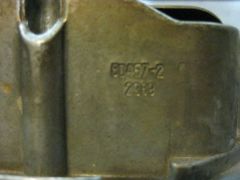 1979 Ford Bronco - A close-up view shows stamped text on a metallic part. The text reads "E0457-2" and "2382".