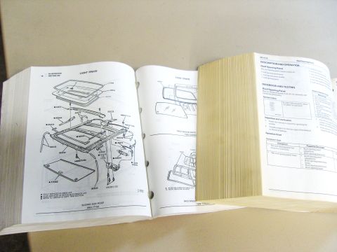 2007 Ford Mustang - Open Ford service manual page showing an exploded parts breakdown of the sliding sun roof assembly with numbered callouts.