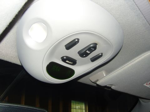 2007 Ford Mustang - Photograph of an overhead console with sunroof control switches and a display, not a technical document.