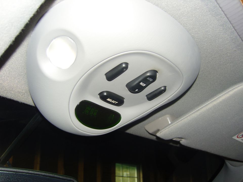 Photo of an overhead console with sunroof switches and display