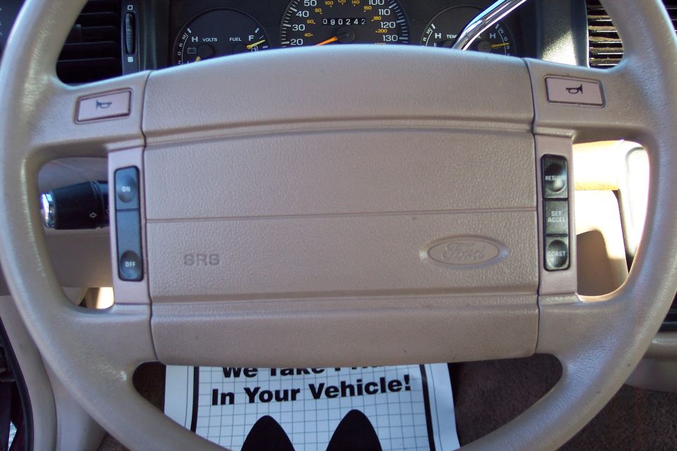 Interior of a Ford Crown Victoria steering wheel and dashboard