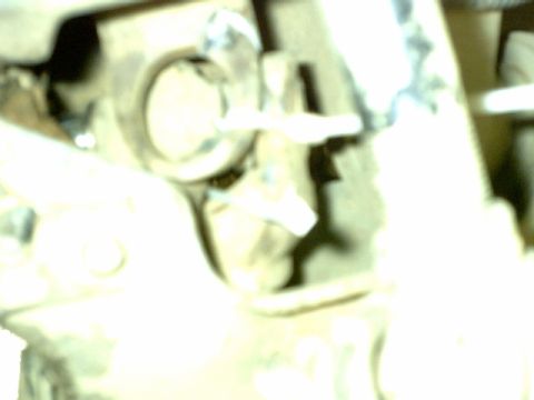 1995 Ford Bronco - A blurry close-up shows a vehicle part, possibly from the drivetrain or suspension system.