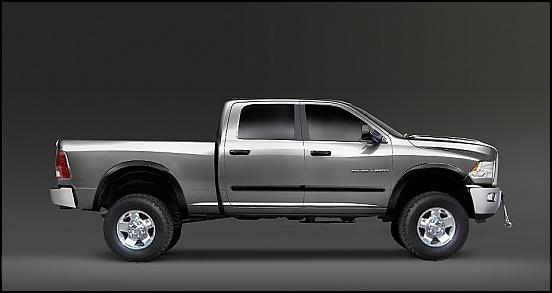 Silver four-door pickup truck in side profile