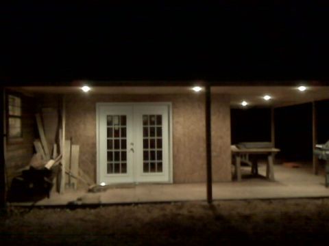 2005 Ford Mustang - A covered porch area with double doors and a table visible.