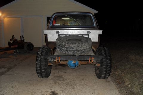 1980 Dodge Magnum - Modified pickup truck rear with custom bumper and large off-road tires.