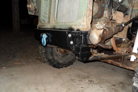 1980 Dodge Magnum - Close-up of a vehicle's front end, focusing on the bumper and suspension system.