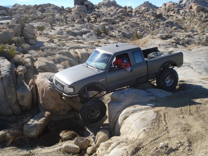 Gray 1997 Ford Ranger off-roading over rocks
