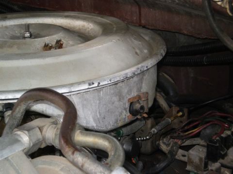 1982 Ford Bronco - This photo shows a close-up view of the air cleaner housing and surrounding engine components.