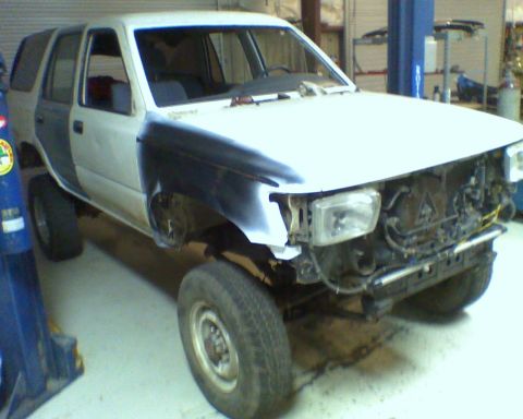 1993 Toyota 4Runner - This 1993 Toyota 4Runner is in a garage, likely undergoing repairs or restoration.