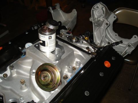 1984 Jeep J-10 - Engine manifold assembly with sealant and parts, ready for installation.