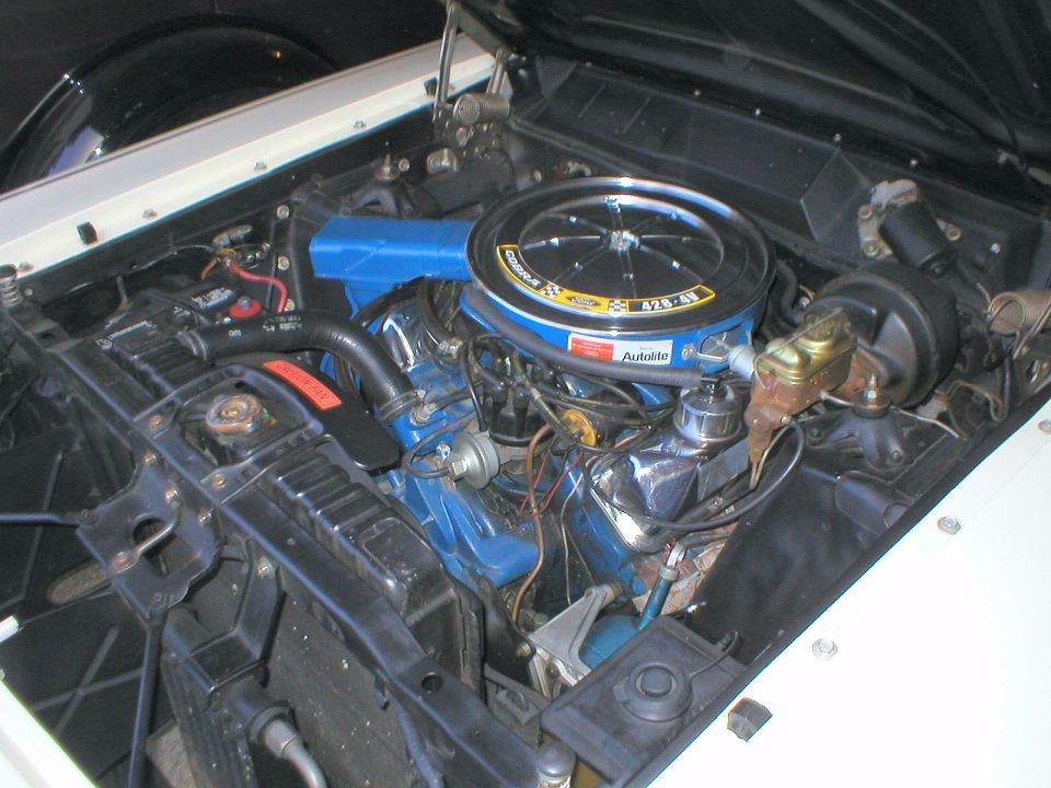 The second part of the set: a restored white Talladega that he also drives.  With a blue one, he'd finish the set.