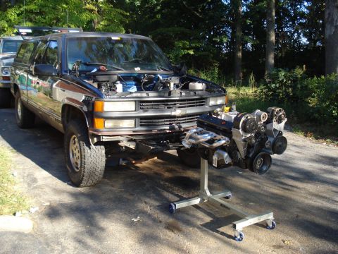 1984 Jeep J-10 - Engine removed from a 1995 Chevrolet Suburban, sitting on an engine stand.
