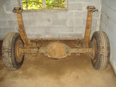 1991 Ford Bronco - This is a rear axle assembly with leaf springs and tires, likely from an older vehicle.
