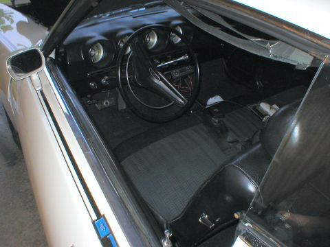 1983 Ford Bronco - The second part of the set: a restored white Talladega that he also drives. With a blue one, he'd finish the set.