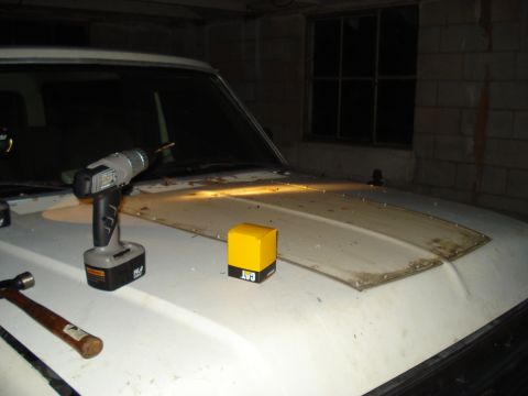 1991 Ford Bronco - Tools are laid out on the hood of a 1991 Ford Bronco, suggesting maintenance or repair work is underway.