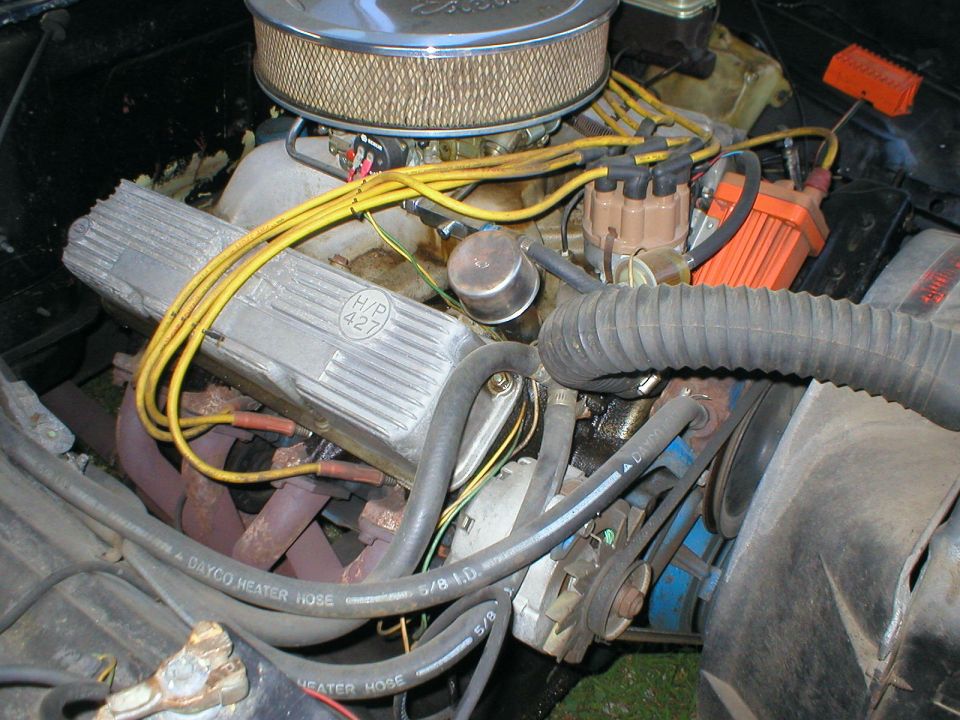 Ford V8 engine bay with chrome air cleaner, 460 valve covers and yellow plug wires