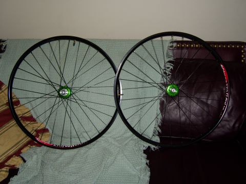 1972 Ford Ranchero - Pair of bicycle wheels with green hubs and black spokes and rims.