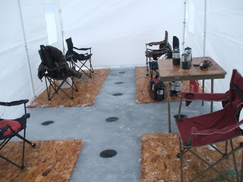 1990 Ford Bronco - This ice fishing tent is set up with seating and a table, ready for a day on the frozen water.