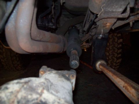 1986 Ford Bronco - Undercarriage view shows exhaust pipes and part of the drivetrain.