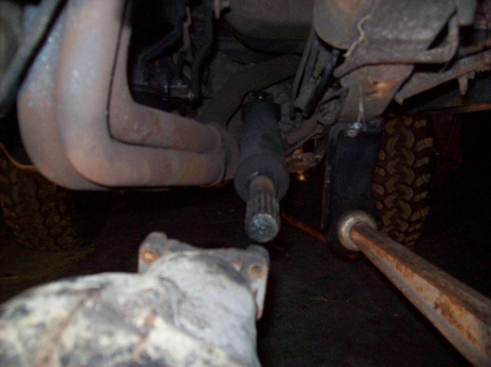 close-up of vehicle's exhaust manifold and driveshaft