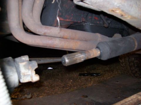 1986 Ford Bronco - Undercarriage view of exhaust pipes and steering components, with a Supermotors.net watermark.