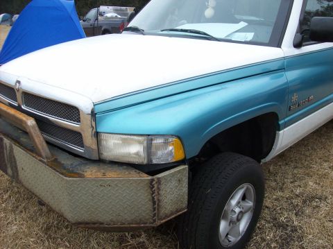 1986 Ford Bronco - This truck's front end is visible, showing a custom bumper and two-tone paint scheme.
