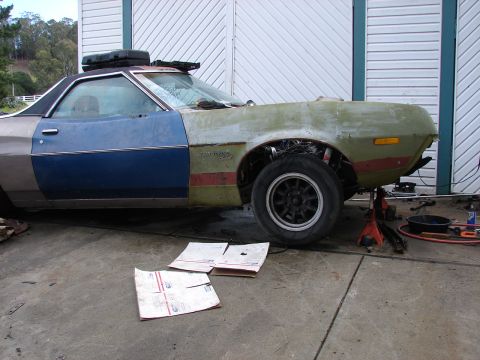 1973 Ford Ranchero - This 1973 Ford Ranchero is in a state of repair, with various panels showing different colors and the front end partially disassembled.