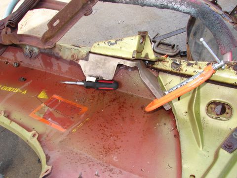1973 Ford Ranchero - A close-up view of a car's inner fender well shows rust and some attached hardware.